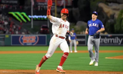 Zach Neto celebrates scoring the winning run for the Los Angeles Angels against the Texas Rangers.